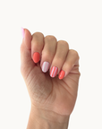 Coral Cabana gel nails shown on a hand