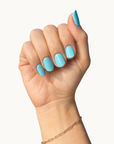 Poolside gel nails shown on a hand