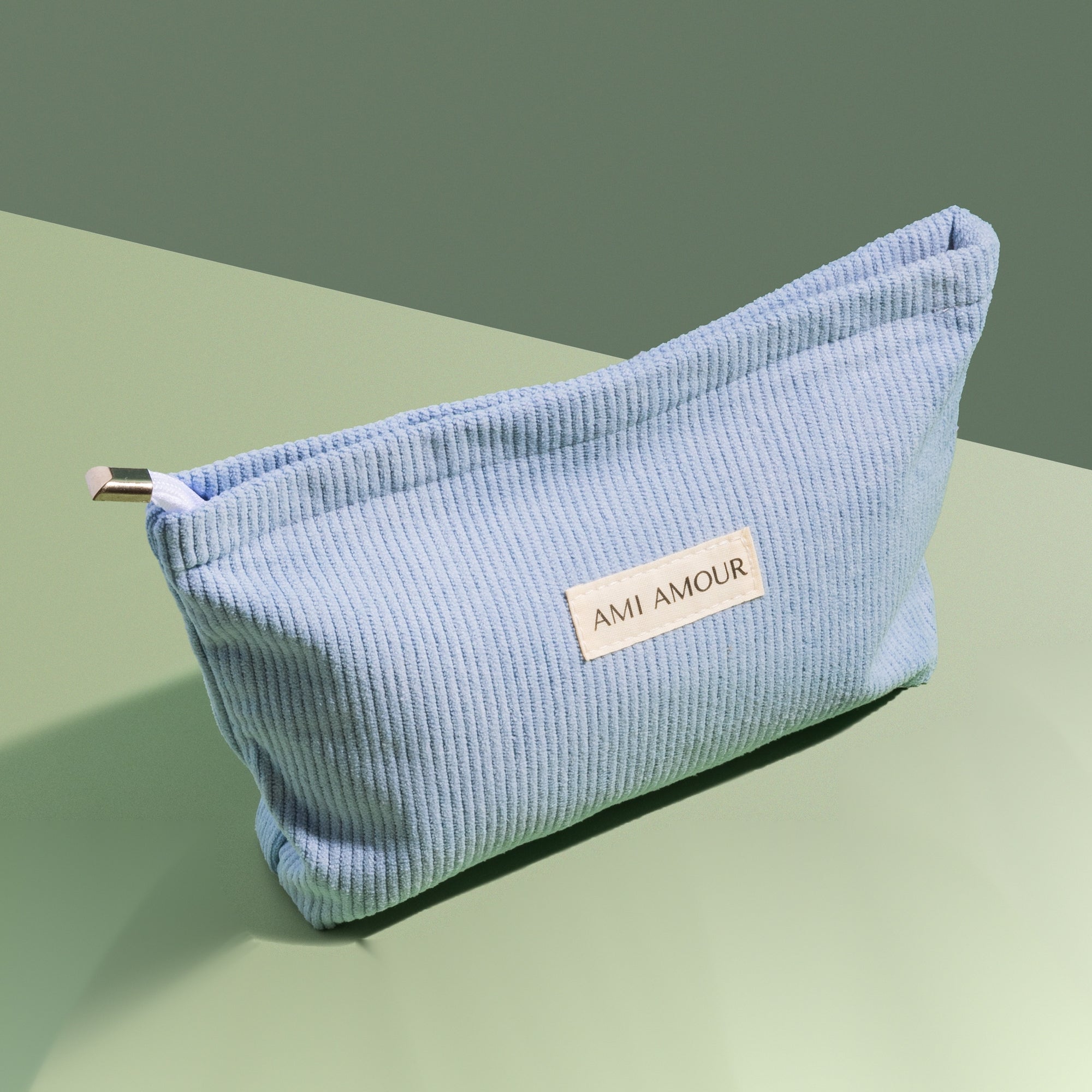 Ami Amour blue corduroy travel bag with logo label — free gift with 7+ gel nail strip sets